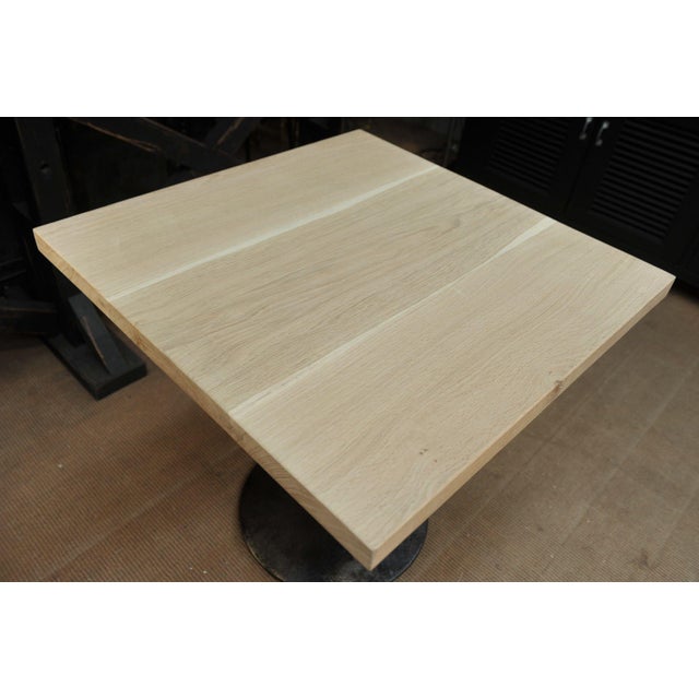 Vintage bistro tables, round metal and brass base, solid oak top.
