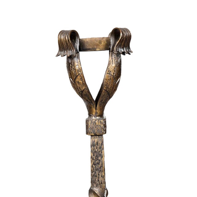 Shaped cup tops and twist support with scrolled legs. Short log holders.