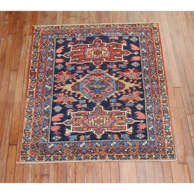 An early 20th-century traditional navy blue and brown square size Persian Heriz carpet. Measures: 3'7" x 4'3" Heriz...