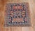 An early 20th-century traditional navy blue and brown square size Persian Heriz carpet. Measures: 3'7" x 4'3" Heriz...
