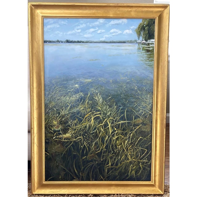 Hidden Garden captures a serene underwater landscape, where the delicate strands of aquatic vegetation sway gently beneath...