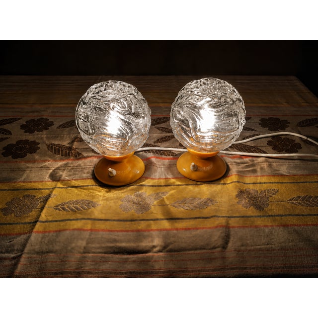 Striking pair of vintage Graewe table lamps, made in West Germany, circa 1970s. Each lamp features a vibrant orange molded...