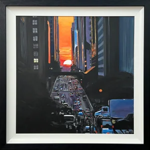 Manhattan Henge at Sunset on Busy New York City Street With Rich Orange Sky & Violet Buildings