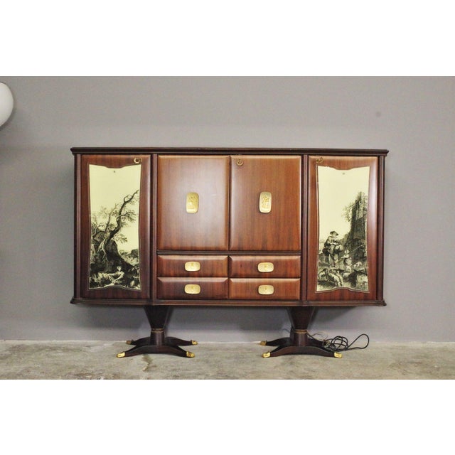 An incredible opportunity to purchase a mid-century italian art cabinet dining set, a complete masterpiece of milanese...