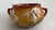 The 1939 Roseville Pottery Hanging Basket Planter in the Iris Pattern is a vintage original piece made of pottery. This...