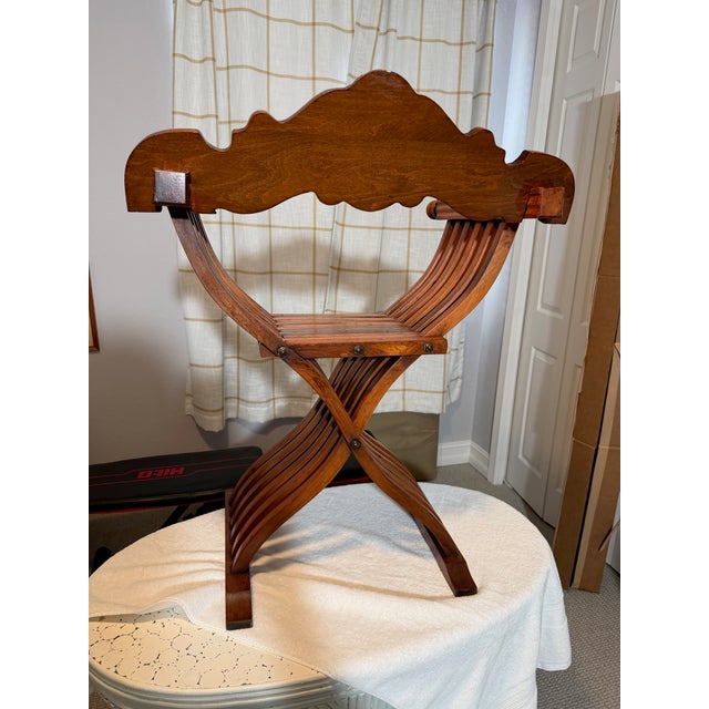 The Italian Renaissance Savonarola Dante Master Chair is a vintage folding chair hand carved from walnut wood These...