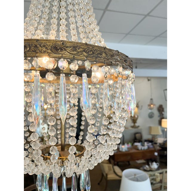 These chandeliers have a beautiful brass-finished base and elegant clear crystals. They are wired for modern use and would...