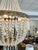 These chandeliers have a beautiful brass-finished base and elegant clear crystals. They are wired for modern use and would...