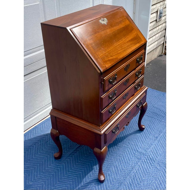 Elevate your home office or entryway with this exceptional mid-20th-century Queen Anne style slant-front secretary desk,...