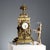 Eclectic-style table clock in richly perforated and chiseled bronze with leafy scrolls and festoons of leaves and fruit,...