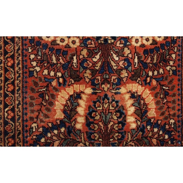 Handmade antique Persian Sarouk rug in original good condition. The rug is from the beginning of 20th century made in...