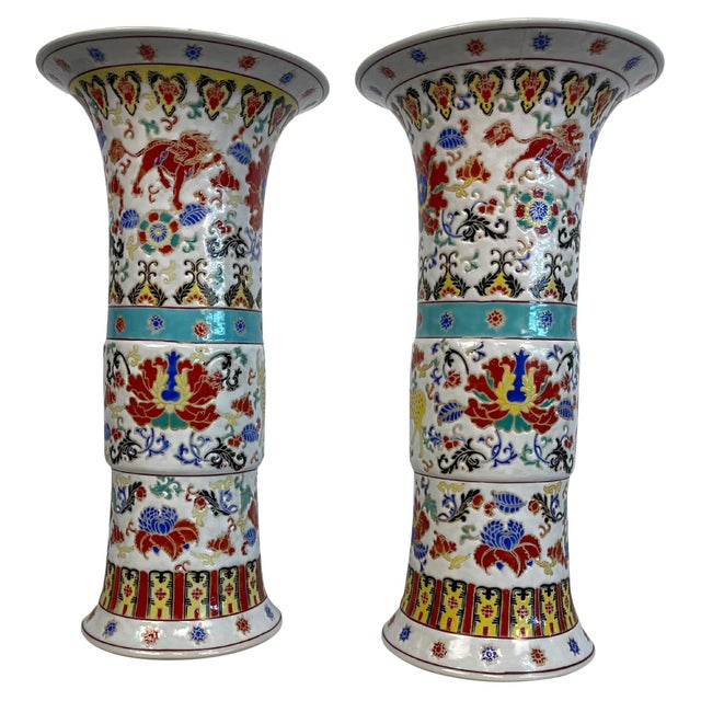 Pair of Yongzheng style Chinese porcelain vases in a high gloss finish in the Gu shape. The vases are decorated with deer,...
