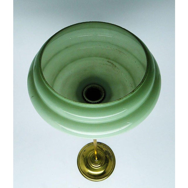 The pendant lamp was produced in the 50s. The construction is brass, glass lampshade. It is preserved in very good...