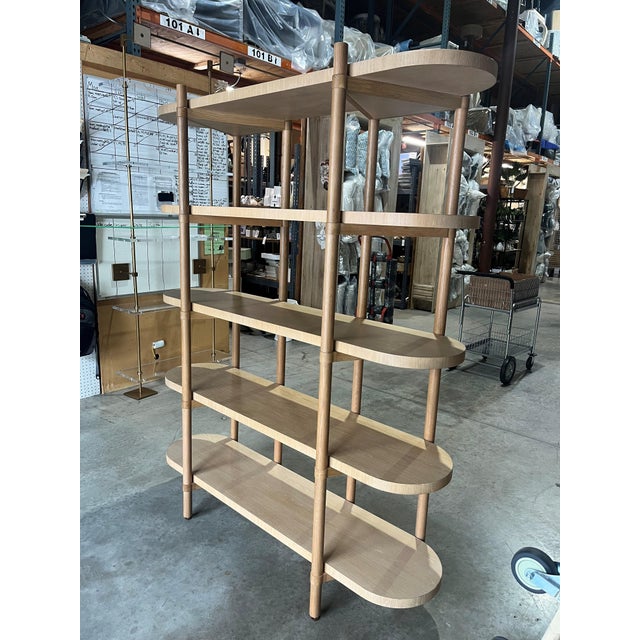 This 60"W x 74"H Four Hands etagere features a warm, light oak finish with a beautifully tactile, natural wood grain. The...