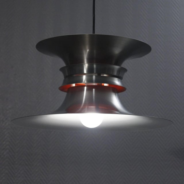 Vintage Scandinavian pendant lamp in matte aluminum with white and orange lacquered interior, designed by Bent Nordsted...