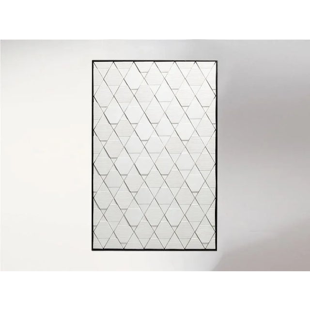 TUA Tiles Panel with lacquered wood frame+. This piece comes in multiple finishes for the tiles and the frame.