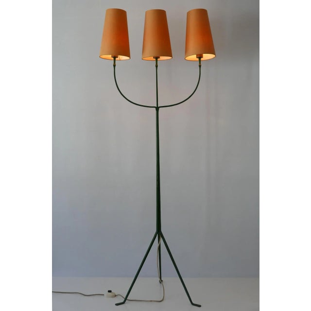 Exceptional and elegant 3-flamed Mid-Century Modern floor lamp in the style of Jean RoyÃ¨re. Manufactured probably in...