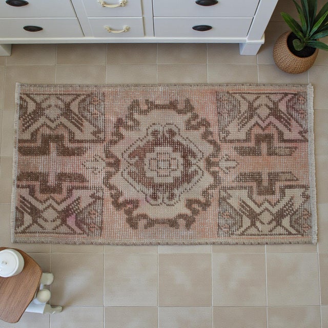 Vintage Turkish Hand-Knotted Small Rug / Mat from Nigde, 1970, featuring warm dusty-rose and earthy brown tones and...