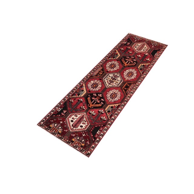 Hand knotted by skilled artisans from 100% wool and colored with all-natural vegetable dyes, this vintage antique-style...