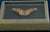 A striking vintage faux butterfly presented in a deep, French gray-painted wooden shadowbox. The Monarch butterfly is...