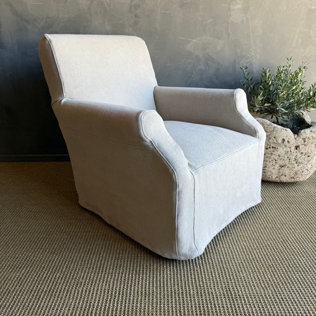 Introducing the Ans Belgian Linen Slip Covered Accent Chair, exuding classic European style with its elegant design....