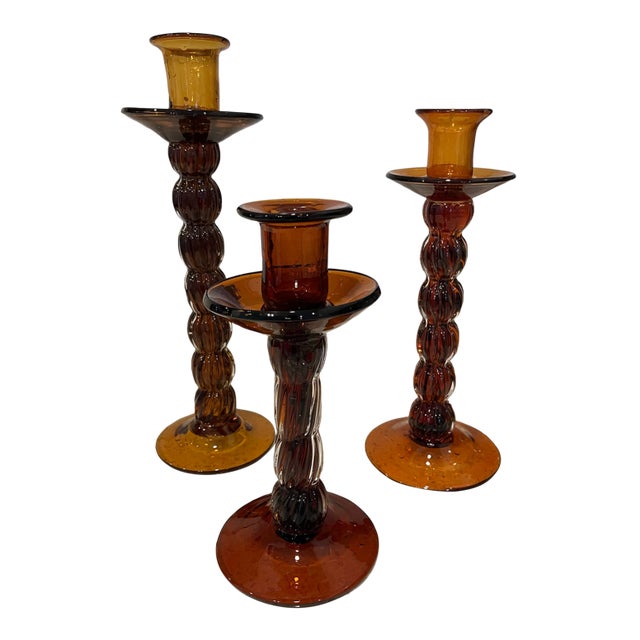 Set of Three Amber Colored Glass Candlesticks For Sale