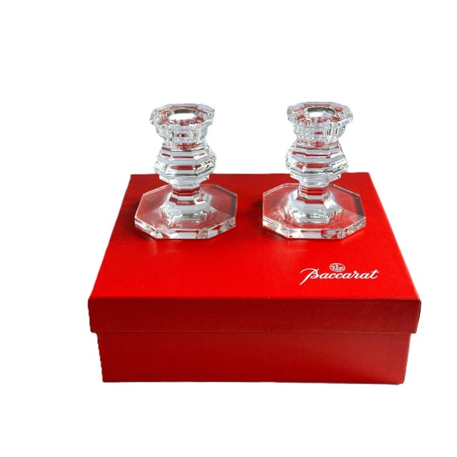 Elegant pair of Baccarat crystal candlesticks from the Regence giftware line, inspired by 18th-century French Louis XV...