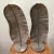 Impeccably detailed pair of large Metal Sculpture’s . It has a silver leaf finish sitting atop a round silver base. This...