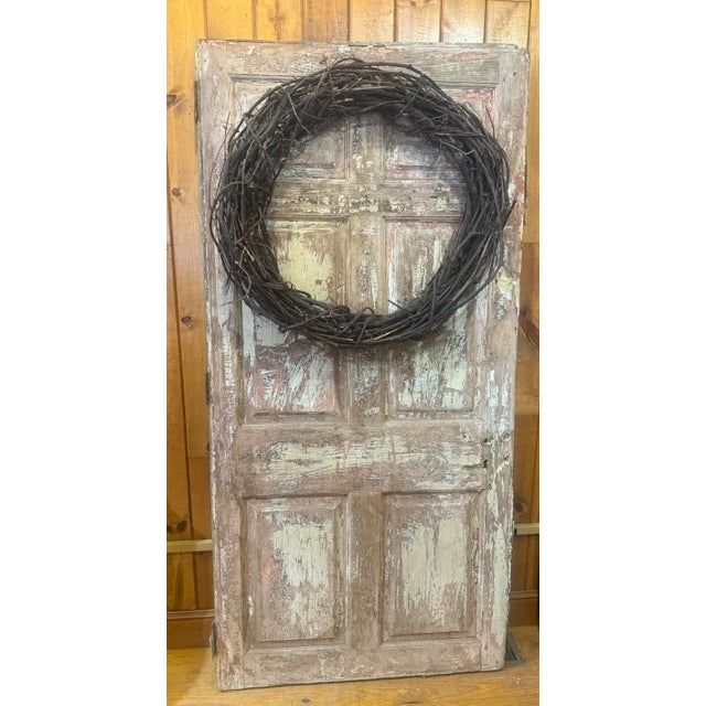 Antique freezer door. Very heavy. Originally a fire door or door for a freezer. Original label on the front of the door....