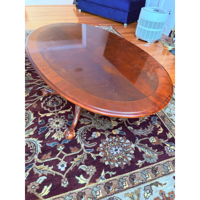An exquisite vintage find from renowned maker Ethan Allen, this elegant oval coffee table captures the finest elements of...