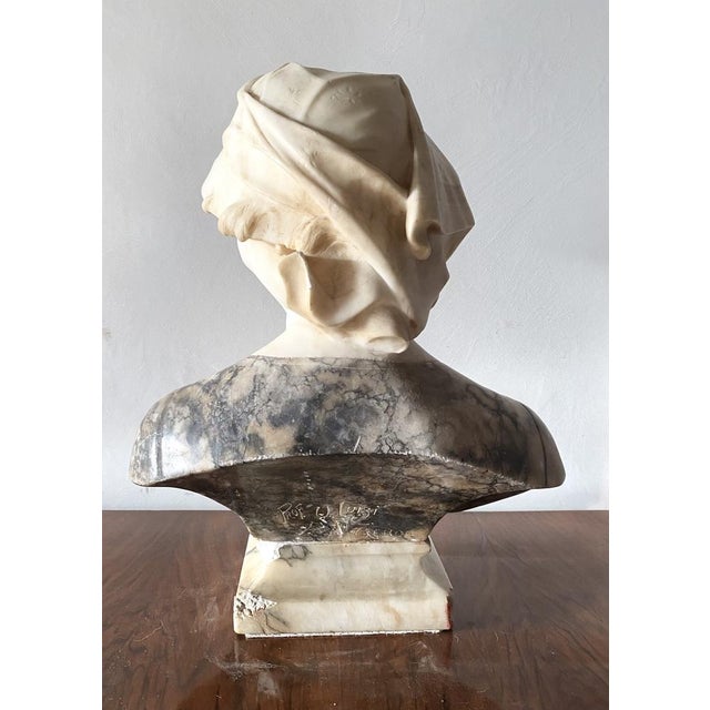 The bust and base are connected by a metal pin. The base has chipping ends as shown in the photos.