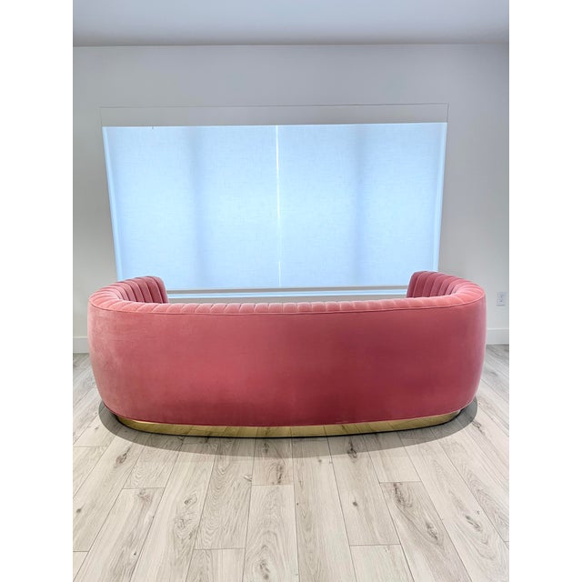 MODSHOP Germain soft curved sofa with channel back tufting; Gold edge base. Fabric: Robert Allen cotton velvet CORAL
