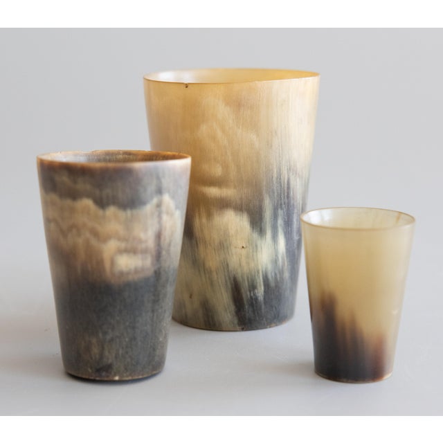 A fine set of three 19th-Century English Victorian graduated polished horn stirrup cups traditionally used for toasting on...
