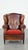 This luxurious vintage, stylish sheep leather wing chair with a red corduroy seat cushion and a beautiful patina. This...