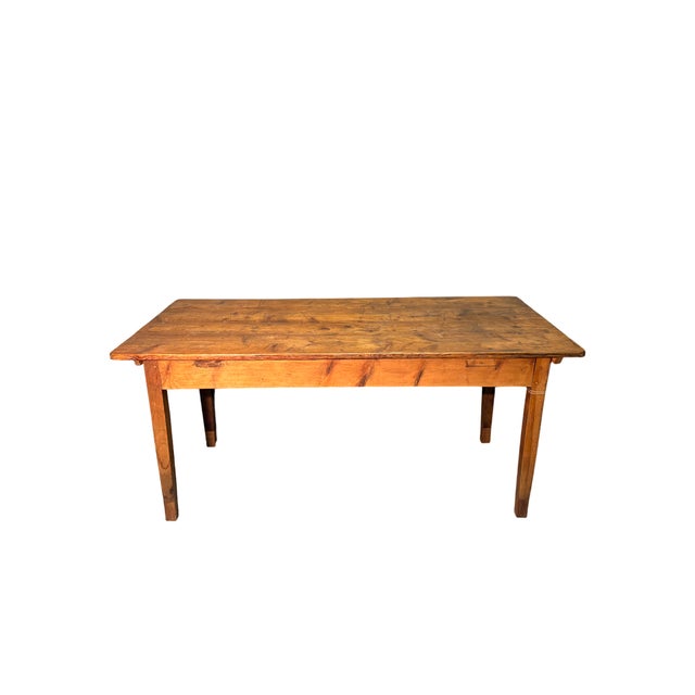 Fir wood dining table, featuring a simple structure and rustic appeal. Solid and functional, it highlights the natural...