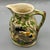 An antique English ironstone jug by Mason's Patent Ironstone China, featuring richly detailed high-relief hunting scenes...