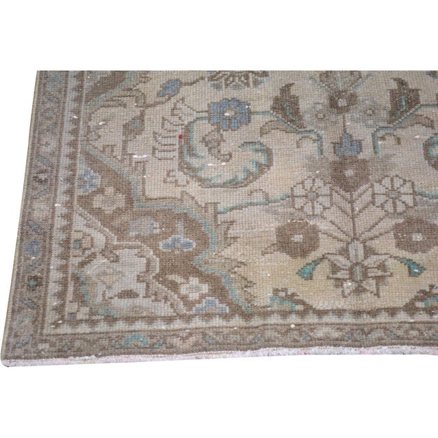 Hand-knotted with care using traditional rug-making techniques, this wool rug blends timeless craftsmanship with a modern...