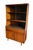 Clean, versatile tall hutch with real wood grain and sculptural mid century modern lines. This piece pairs display...