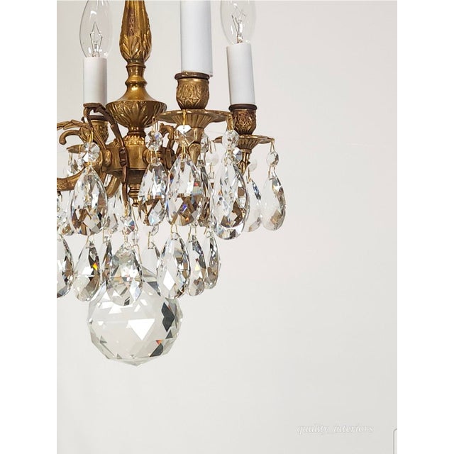 Offered for your consideration is an Antique 4 Arm 4 Light Glowing Graceful Brass Cut Lead Glass Crystal Chandelier. The...
