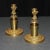 An unusual pair of Russian Neo Classic bronze dore candlesticks with lobed cups mounted with lion heads and paw feet,...
