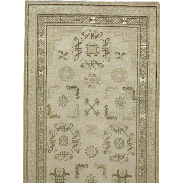 An early 20th century Khotan runner. Measures: 3' 6" x 13' 0"