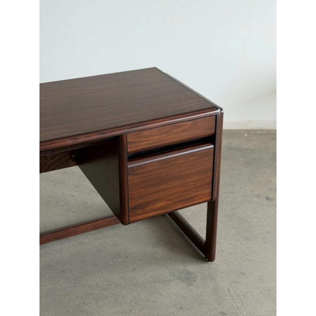 W74 D25 D25 H33 Knee Clearance28 Depth24 Width35.5 Elevate your workspace with this exceptional Mid-Century Modern...