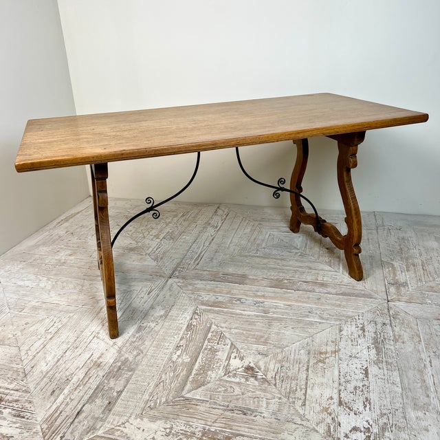A Lovely Antique Spanish Oak and Wrought Iron Kitchen, Dining, or Centre Table This charming piece features a rectangular...