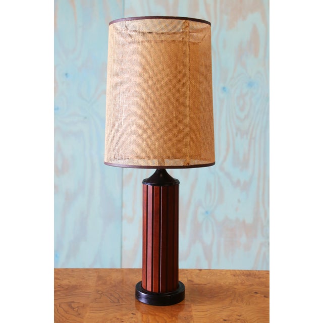 A 1960s Gruvwood lamp. Retro goodness with a double shade of cane. Wood slat base. It does not get groovier than this....