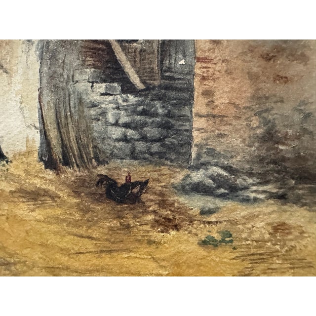 Original watercolor on paper attributed to Frank Henry Mason, depicting a rustic village courtyard with weathered stucco...