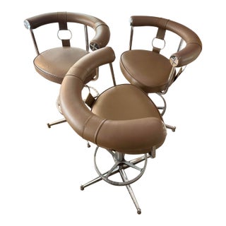 A Set of 3 Swivel Bar Stools Attributed to Daystrom Furniture of Boston, Featuring a Taupe Faux Leather Upholstery With Chrome Frames, Circa 1970s. For Sale
