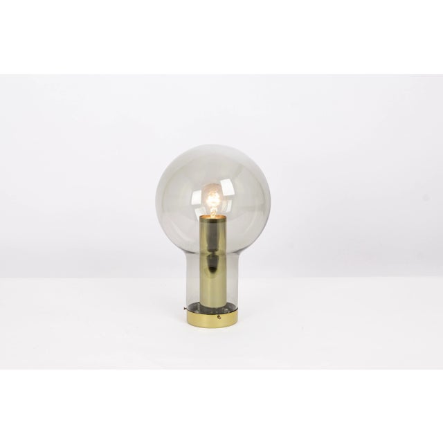 1 of 20 maxi bulb flush mounts designed by raak, netherlands, 1970s. Smoked glass in a very beautiful smokey brown color....