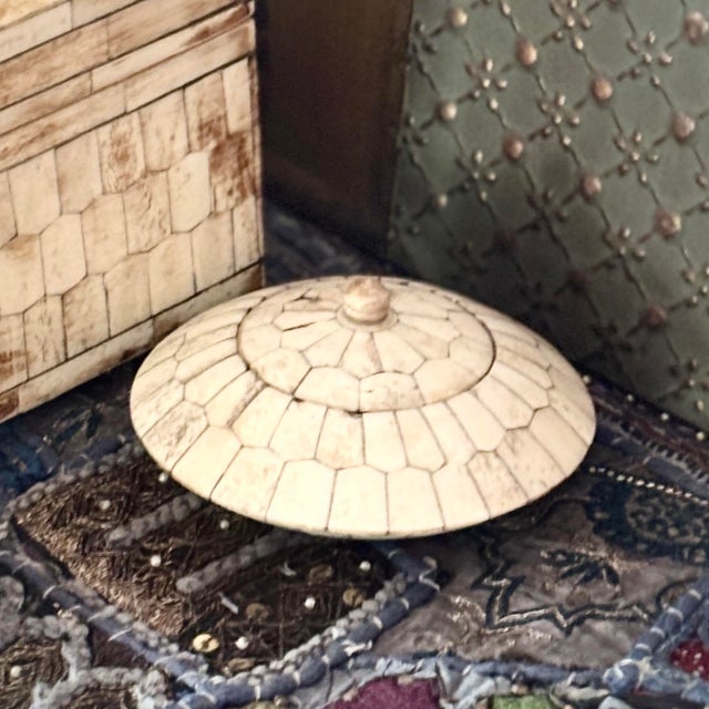 A sleek and highly distinctive Maitland-Smith vintage tessellated bone trinket box featuring an organic, low-profile...