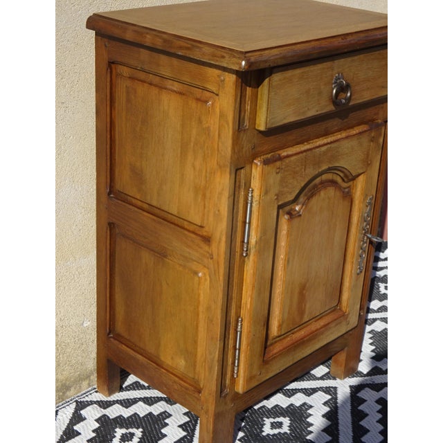 Solid oak top with rounded edges, sanded and varnished with a matte clear finish. One storage drawer with an aged metal...