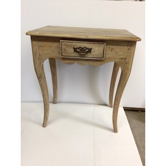 This small mahogany table has been bleached and waxed. It has exceptional eye appeal. The distressed and wood dowels...